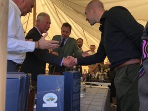 HRH, The Prince Charles shaking hands